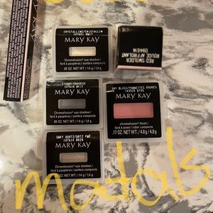 Several sets of eyeshadows with blush, eyeliner and lipstick